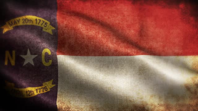 American State Closeup of grunge North Carolina waving flag loopable stock video