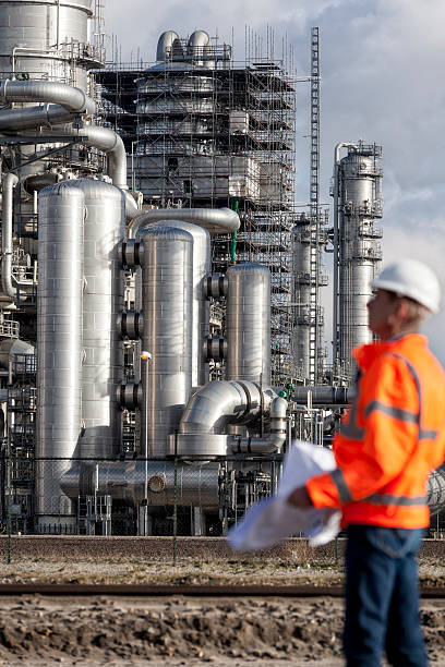 istock Petrochemical inspector with drawing 163888939