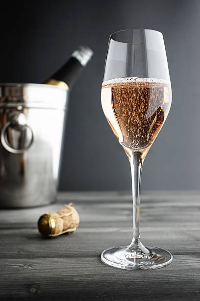Glass of Rose / Pink Champagne and Cooler Glass of Rose / Pink Champagne and Cooler, selective focus rose champagne stock pictures, royalty-free photos & images