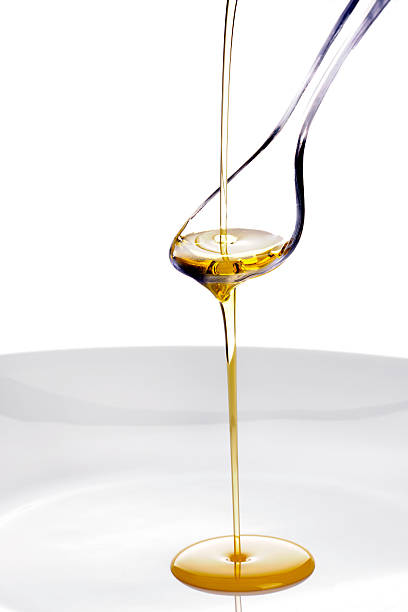 istock Olive Oil poured onto a spoon 163894112