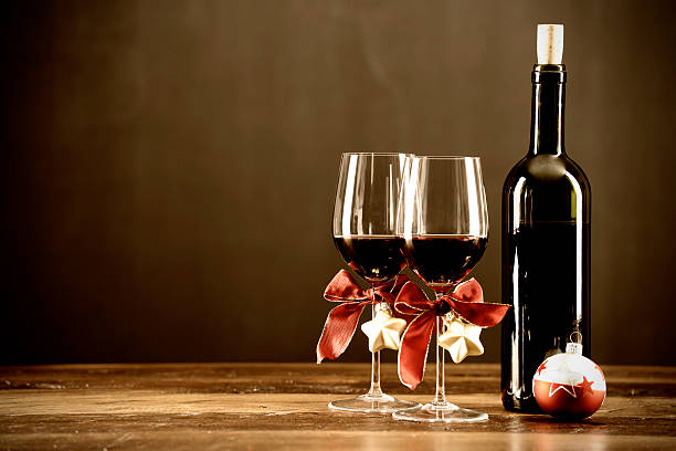Red wine, bottle and christmas baubel stock photo