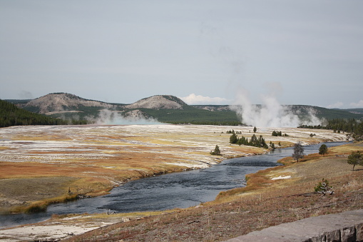 Blue colored hot springs at Norris Geyser Basin in the winter