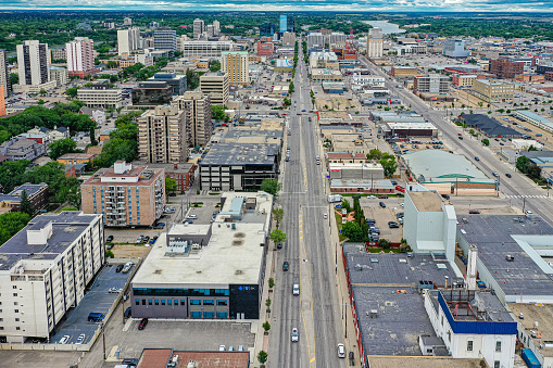 Aerial view of the Central Business District which is Saskatoons bustling neighbourhood of downtown living and business development. If you love the thriving energy of your neighbourhood streets lined with coffee shops, restaurants, shopping, gorgeous Meewasin, skating rink, river, trails and nightlife then this community is for you.