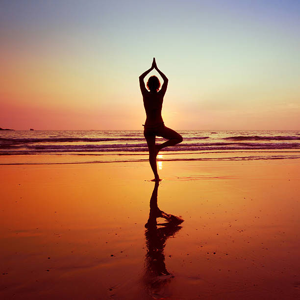 istock Yoga on the beach 163896391