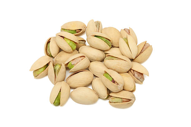 istock Pile of pistachios on white background 163896454