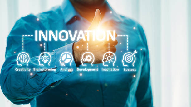 istock Innovation concept. Businessman shows the word innovation on the virtual screen. 1639009717