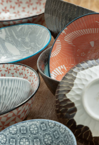 istock Collection of ceramic bowls on rustic wood background. 1639009738