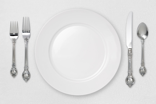 White Place Setting on tablecloth with a clipping path