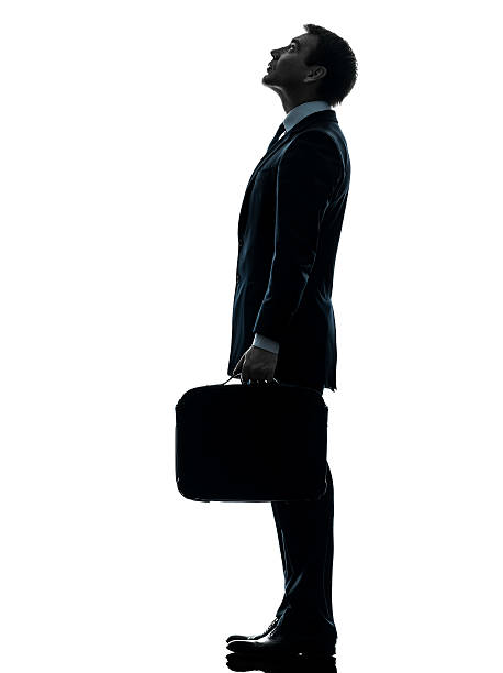 istock business man standing looking up silhouette 163902145