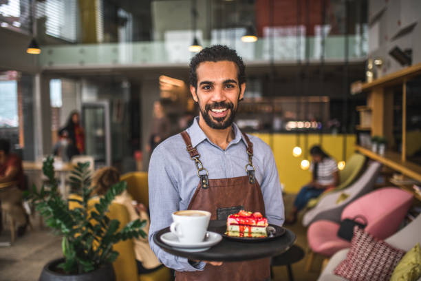 istock Middle Easter Waiter Holding A Serving Tray In A Cafe 1639022459