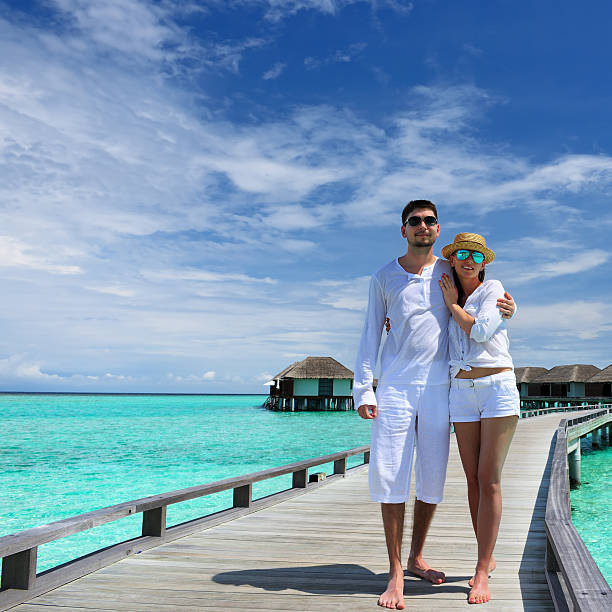 istock Couple on a beach jetty at Maldives 163902709