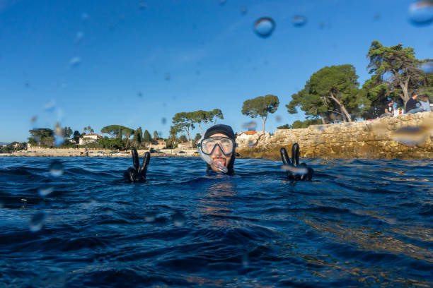 istock A man in snorkelling gear over the water surface 1639029253