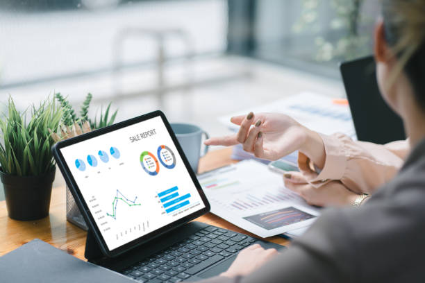 istock Two businesspeople or an accountant team are analyzing data charts, graphs, and a dashboard on a laptop screen in order to prepare a statistical report and discuss financial data in an office. 1639029487