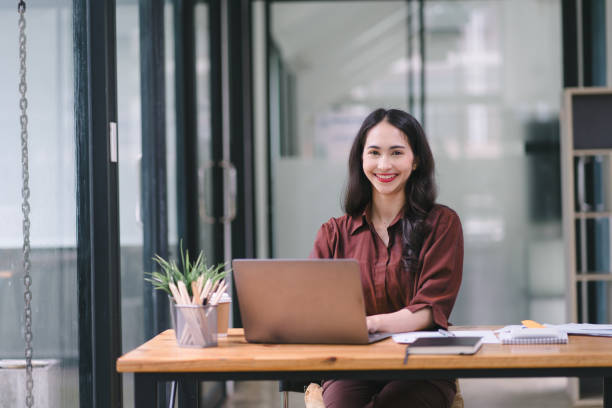 istock An Asian businesswoman is using a laptop computer and working with a calculator and documents, conducting financial planning for investments and analyzing the financial report. 1639033053
