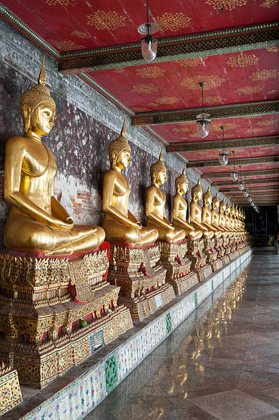 Row of golden Buddha's Bangkok stock photo