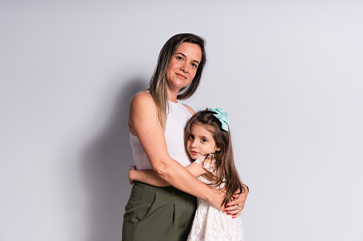 Portrait of daughter hugging mother