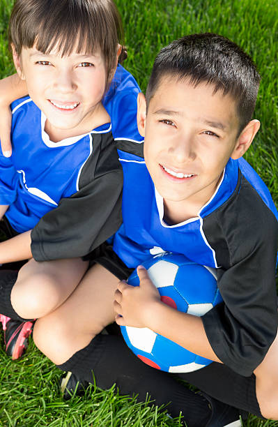 istock Young boy and girl taking a break from soccer 163906413