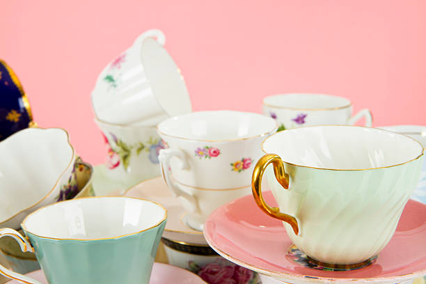istock Pretty Antique Teacups On Pink 163907183