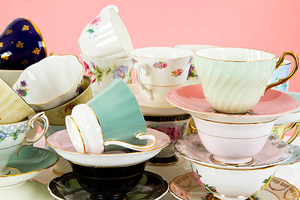 istock Pretty Antique Teacups On Pink 163907184