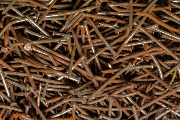 rusty nails Metal oxide. corrosive rust on old nail - background tornillo stock pictures, royalty-free photos & images