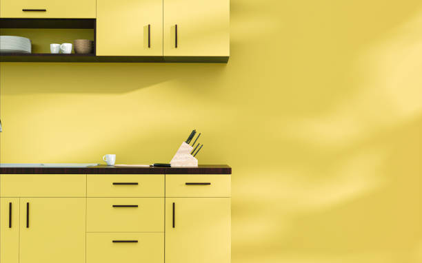 istock Chartreuse yellow modern kitchen interior with mahogany wood, sunlight, and copy space. 1639079963