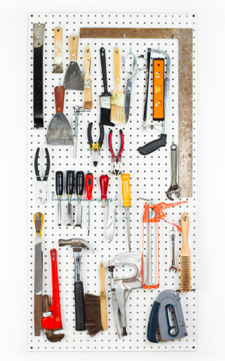 Tools hanging On An Organized pegboard