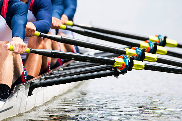 Close up of men's rowing team Close up of a men's quadruple skulls rowing team, seconds after the start of their race aquatic sport photos stock pictures, royalty-free photos & images