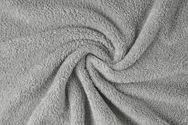 istock Terry cloth, gray towel texture background. Soft fluffy textile bath or beach towel material 1639174178