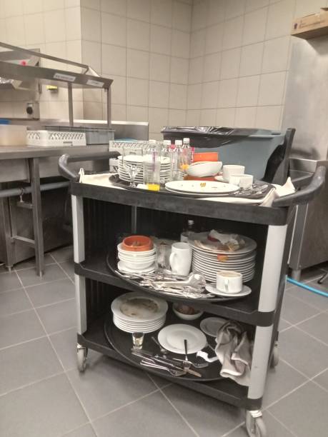 istock dirty dishes piled up in a trolley. 1639262918