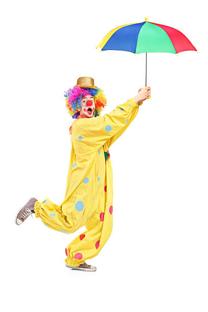 istock Male clown with umbrella 163934651