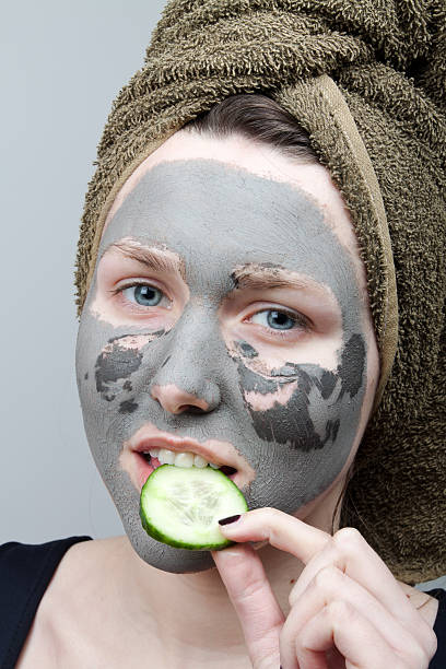 Clay facial mask Clay facial mask. The portrait of young woman. women facial mask mud cucumber stock pictures, royalty-free photos & images