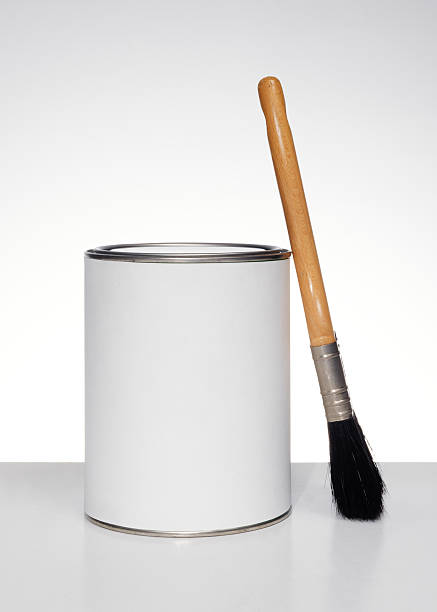 istock paintbrush leaning on paint can 163937658