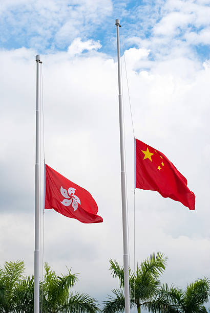 istock China & Hong Kong flag at Half-mast 163939689