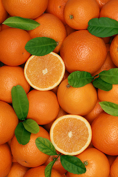 istock Group of freshly picked oranges with leaves 163941365