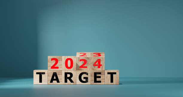 istock 2024 target concept. flip wood cube change year 2023 to 2024 1639420615