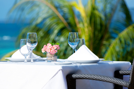 fine dining table setting in tropical surrounding.