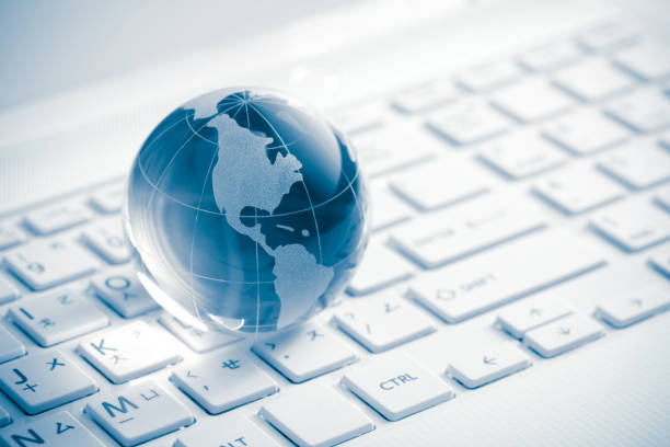 Globe showing Americas on white keyboard