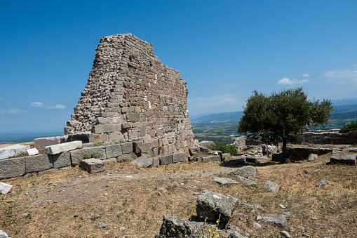 Bergama, Turkey - August 26, 2023:ACROPOLIS OF PERGAMON\nIn 2014, Bergama was included in the World Cultural Heritage List. Although Bergama has been subjected to invasions and destructions throughout its history, it has been continuously inhabited due to its strategic location and is one of the settlements that have never disappeared from the stage of history.  \n Local and foreign tourists visit here