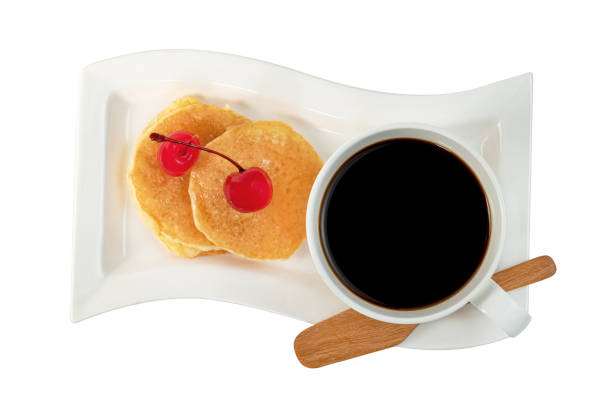 coffee cup with pancakes and cherry isolated on white background ,include clipping path