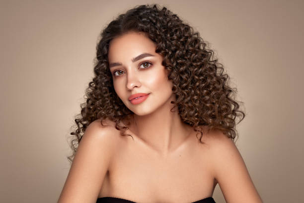 istock Beautiful smiling woman with afro curls 1639469595