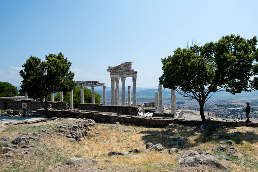 Bergama, Turkey - August 26, 2023:ACROPOLIS OF PERGAMON\nIn 2014, Bergama was included in the World Cultural Heritage List. Although Bergama has been subjected to invasions and destructions throughout its history, it has been continuously inhabited due to its strategic location and is one of the settlements that have never disappeared from the stage of history.  \n Local and foreign tourists visit here