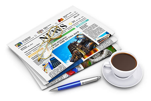 istock Stack of business newspapers and coffee cup 163948485