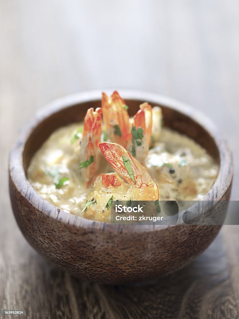 shrimps in tomato cream curry sauce close up of a bowl of shrimps in tomato cream curry sauce Close-up Stock Photo