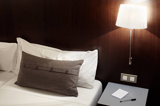 istock Modern bedroom, pillow and lamp at night 163952916