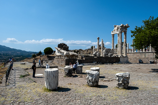 Bergama, Turkey - August 26, 2023:ACROPOLIS OF PERGAMON\nIn 2014, Bergama was included in the World Cultural Heritage List. Although Bergama has been subjected to invasions and destructions throughout its history, it has been continuously inhabited due to its strategic location and is one of the settlements that have never disappeared from the stage of history.  \n Local and foreign tourists visit here