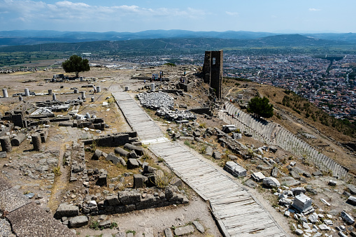 Bergama, Turkey - August 26, 2023:ACROPOLIS OF PERGAMON\nIn 2014, Bergama was included in the World Cultural Heritage List. Although Bergama has been subjected to invasions and destructions throughout its history, it has been continuously inhabited due to its strategic location and is one of the settlements that have never disappeared from the stage of history.  \n Local and foreign tourists visit here