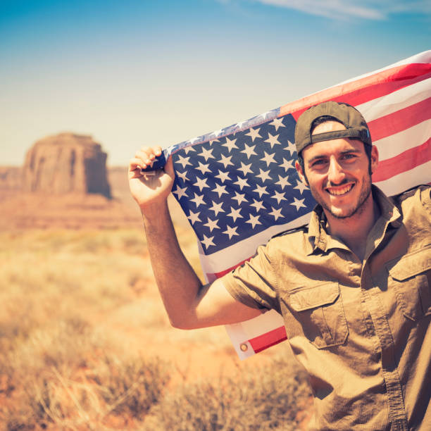 Tourist on the Monument valley with flag