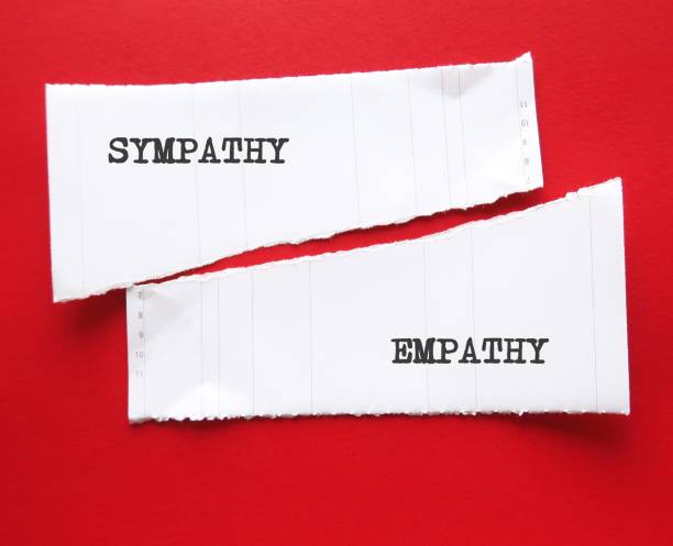 istock Two torn paper on red background with words EMPATHY (ability to understand feelings as if we were having them ourselves) and SYMPATHY (understanding someone else suffering) 1639572121