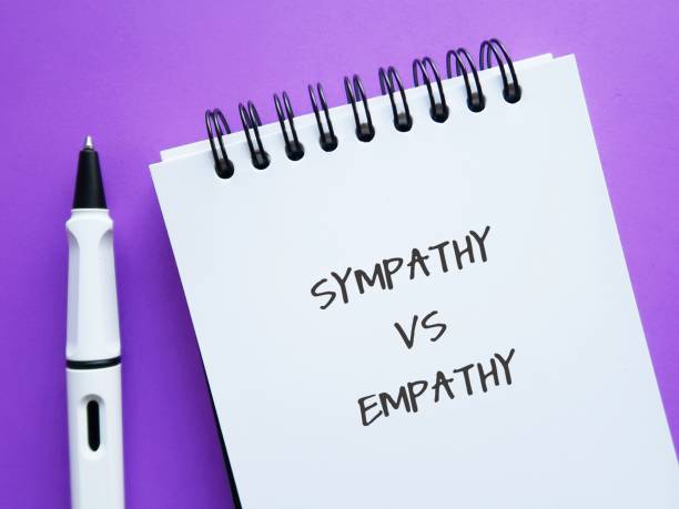 istock On purple background, notebook with handwritten words EMPATHY (ability to understand feelings as if we were having them ourselves) and SYMPATHY (understanding someone else suffering) 1639572126