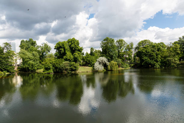 istock Landscape with lake, trees and clouds 1639618822